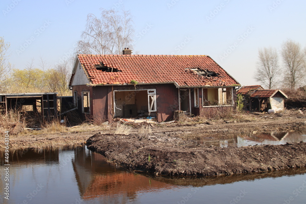 Dilapidated houses with a hole in the roof on the s'-Gravenweg ready to be demolished Dilapidated houses with a hole in the roof on the s'-Gravenweg ready to be demolished