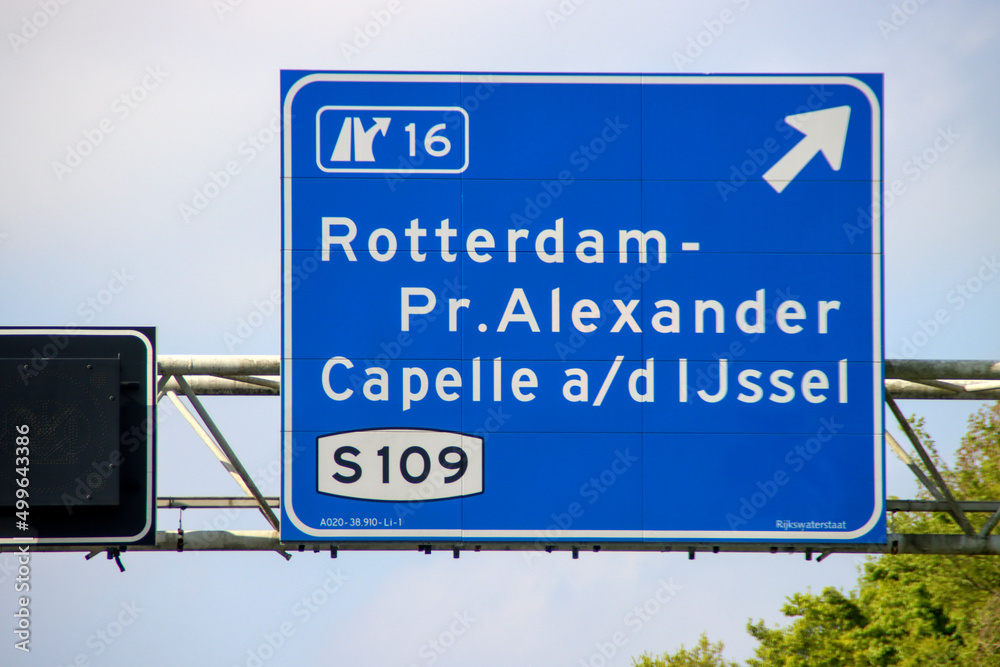 Blue Direction sign for the directions on Motorway A20 for junction 16 Alexander and Capelle