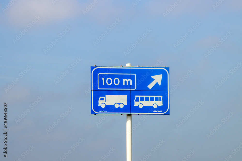 Blue information sign for the directions on Motorway A20 for special lane for trucks and buses Blue information sign for the directions on Motorway A20 for special lane for trucks and buses