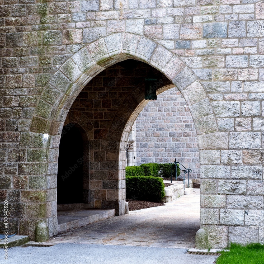 The historic church has an archway made of stone.