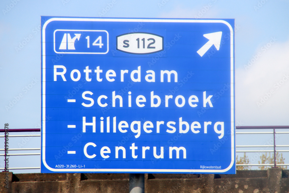 Blue direction and information sign for the directions on Motorway A20 heading to junction 14 S112 to Schiebroek, Hillegersberg and Centrum Blue direction and information sign for the directions on Motorway A20 heading to junction 14 S112 to Schiebroek, Hillegersberg and Centrum