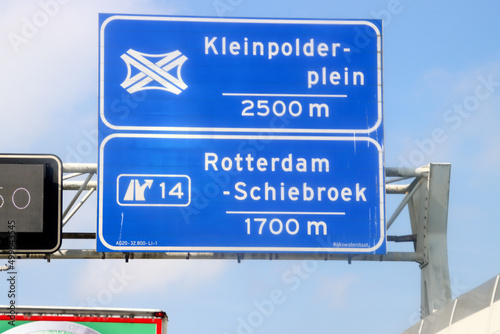 Blue direction and information sign for the directions on Motorway A20 heading crossing Kleinpolderplein and junction 14 photo