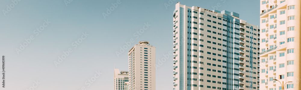 Wall With A Balcony Of New Empty Modern Multi-storey Residential Building House In Residential Area On Blue Sky. Panorama, Panoramic View.