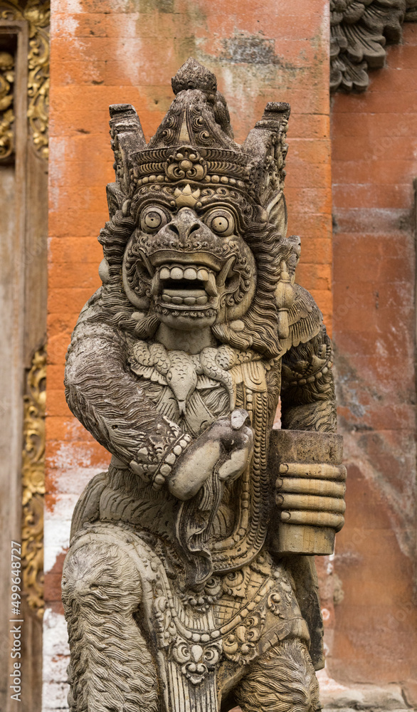 Demon face stone carving at Tirta Empul Temple, Bali, Indonesia