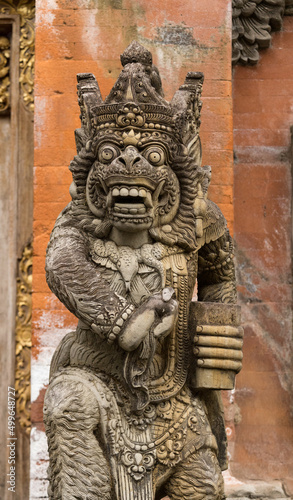 Demon face stone carving at Tirta Empul Temple, Bali, Indonesia
