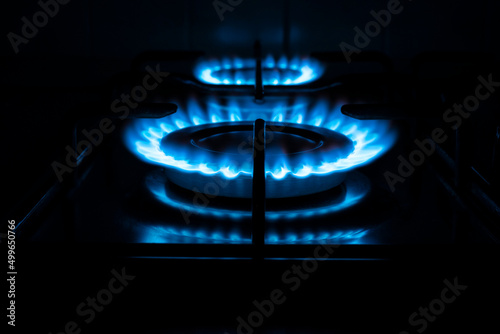 Natural gas burning on kitchen gas stove in the dark