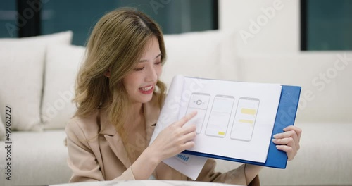 Young business woman presenting infographic chart via video conference by tablet at home office. Online meeting. Working remotely at home concept
