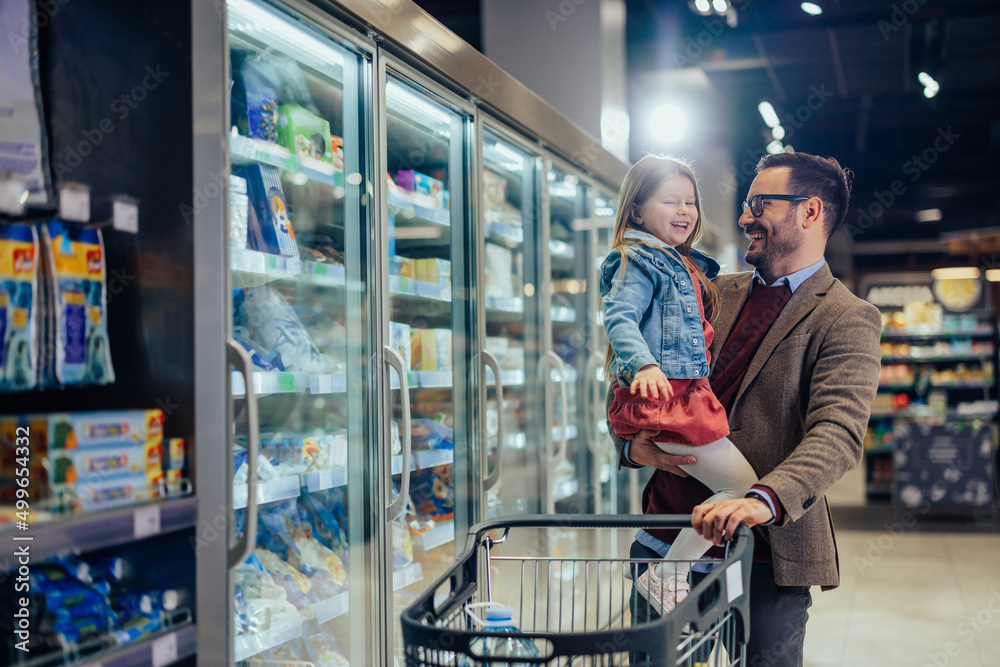 Father and his daughter in a supermarket Father and his daughter in a supermarket