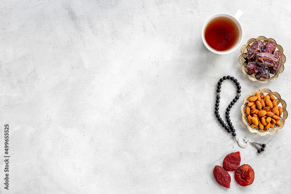 Islamic rosary with dates and tea. Ramadan Kareem concept. Islamic rosary with dates and tea. Ramadan Kareem concept.