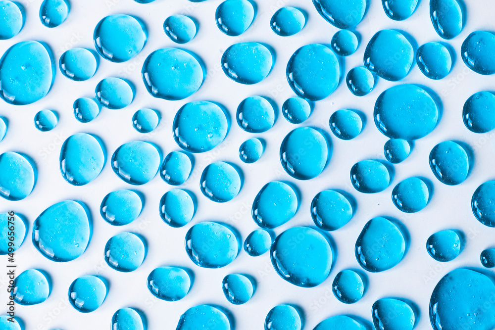 Gel blue drops forming a background. The concept of protection against viruses or cosmetics. Perfect gradient background for presentation Gel blue drops forming a background. The concept of protection against viruses or cosmetics. Perfect gradient background for presentation