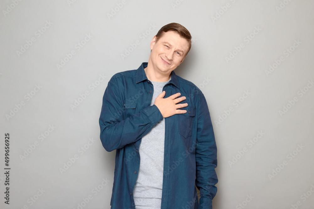 Portrait of happy mature man thanking somebody, expressing gratitude Portrait of happy mature man thanking somebody, expressing gratitude