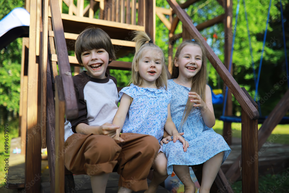 Obraz premium Children walk in the summer in nature. Child on a sunny spring morning in the park. Traveling with children.