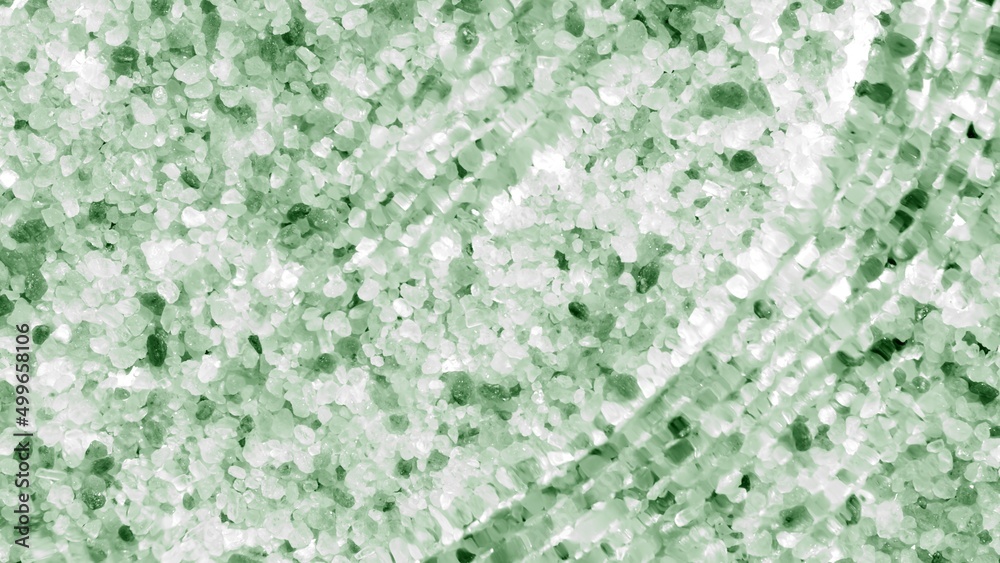 Fototapeta premium Water waves and ripples coming from above over green mineral crystal background | Background for beauty and skin care product