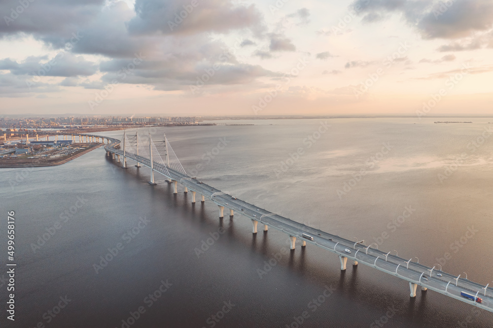 Panoramic industrial landscape with elevated highway over sea in Saint Petersburg, Russia aerial view at sunset Panoramic industrial landscape with elevated highway over sea in Saint Petersburg, Russia aerial view at sunset