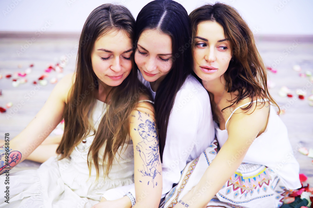 Obraz premium Women's Recovery Group. Yoga girl. Diverse Girls Smiling Holding Hands Sitting In Circle Indoor. Selective Focus.