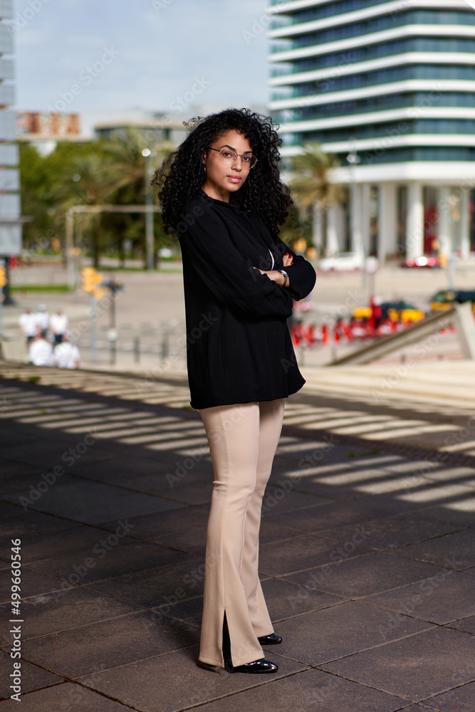 woman with afro hair at city