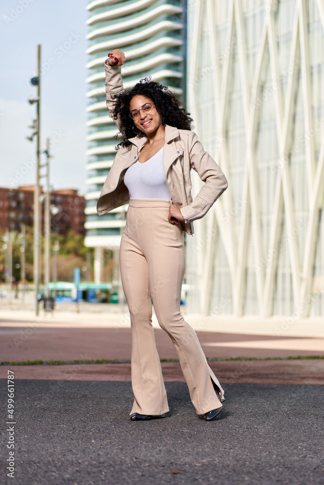 Portrait of a beautiful natural young woman with afro smiling happiness. Outdoor portrait Portrait of a beautiful natural young woman with afro smiling happiness. Outdoor portrait