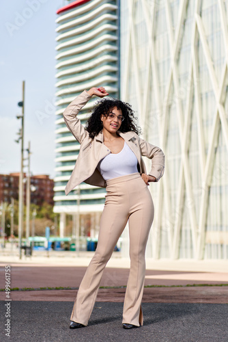 Portrait of a beautiful natural young woman with afro smiling happiness. Outdoor portrait