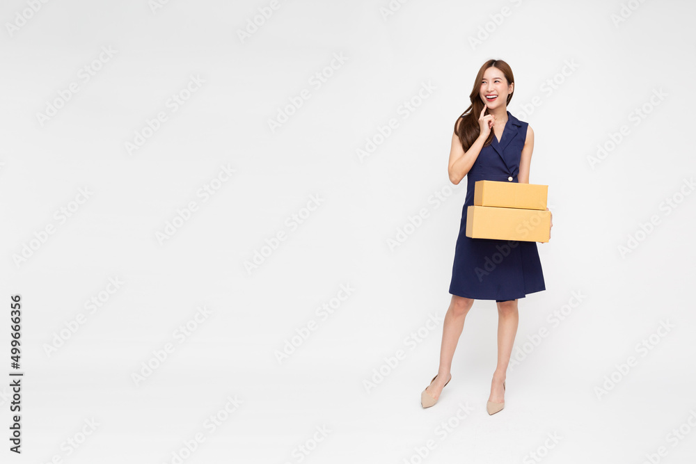 Asian woman holding package parcel box isolated on white background, Delivery courier and shipping service concept, Full length composition Asian woman holding package parcel box isolated on white background, Delivery courier and shipping service concept, Full length composition