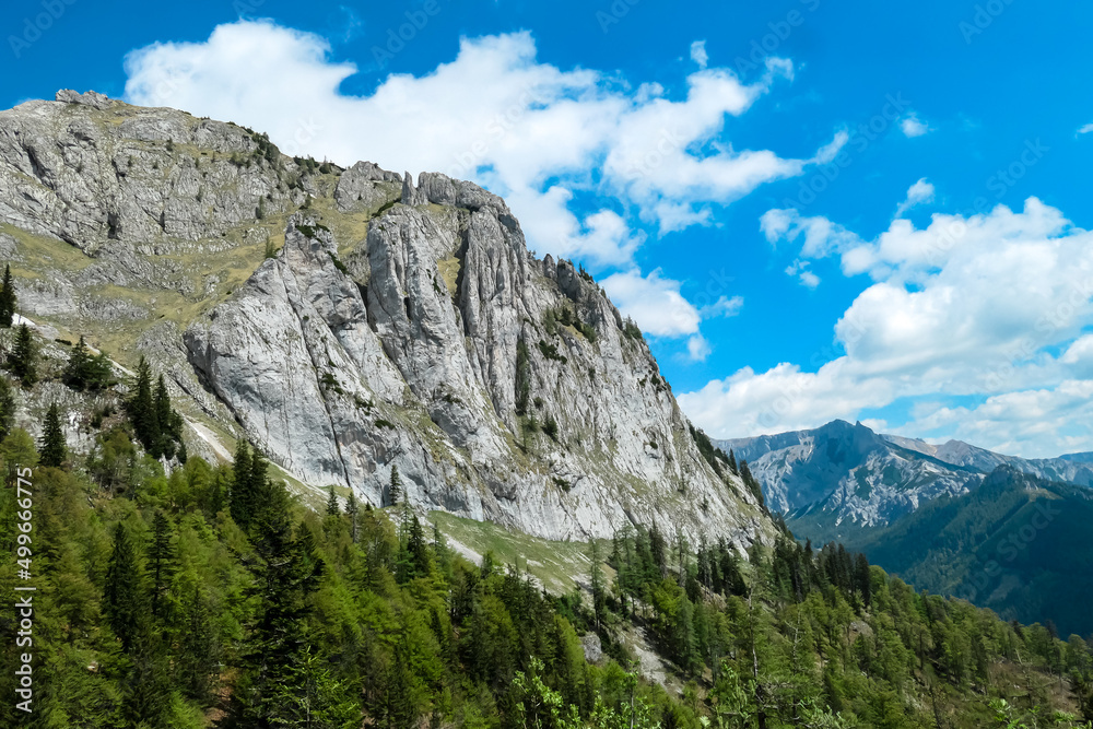 Panoramic view on the mountain peaks of the Hochschwab Region in Upper Styria, Austria. Sharp summit of Zinken in the beautiful Alps in Europe. Climbing tourism, wilderness. Concept freedom