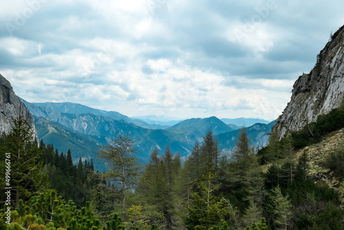 Panoramic view on Buchbergkogel and mountain peaks of Hochschwab Region in Upper Styria, Austria. Cloudy and misty atmosphere in beautiful Alps in Europe. Terrain full of dwarf mountain pine bush © Chris