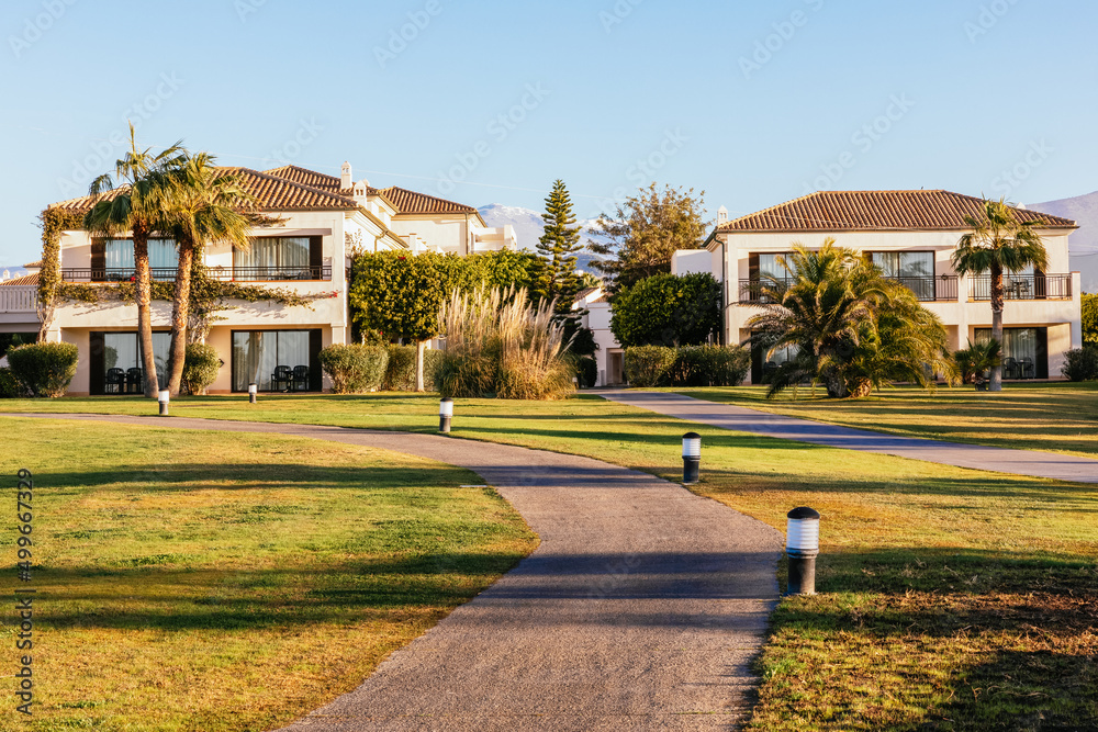 Obraz premium Sunset at the luxury beach resort with golf course in Motril in southern Spain,