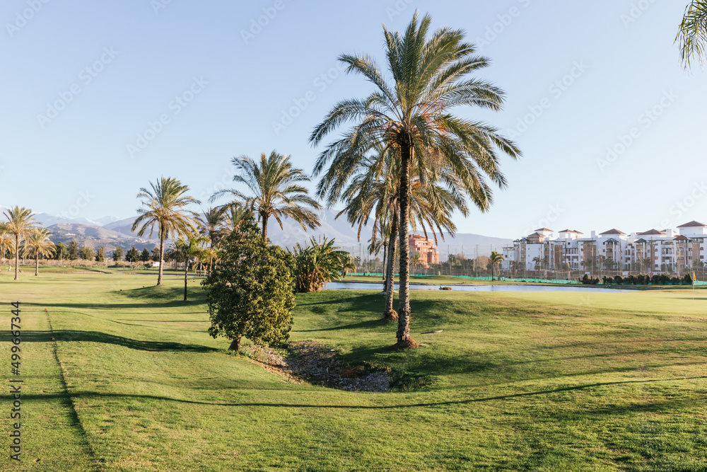 Obraz premium Sunset at the luxury beach resort with golf course in Motril in southern Spain,