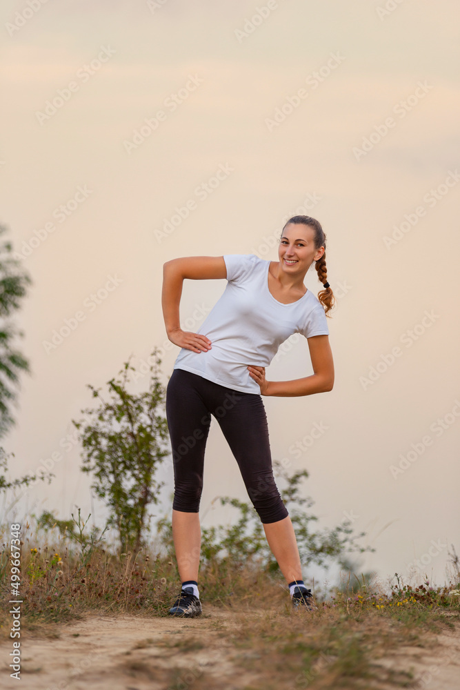 portrait of a woman running on a dirt road portrait of a woman running on a dirt road