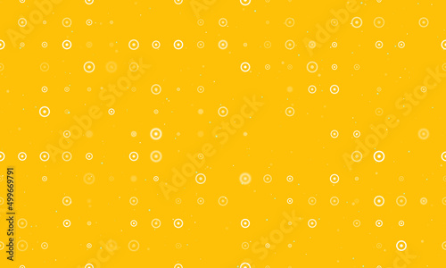 Seamless background pattern of evenly spaced white astrological sun symbols of different sizes and opacity. Vector illustration on amber background with stars