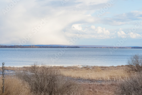 Scenic rural landscape with dry grass on field.