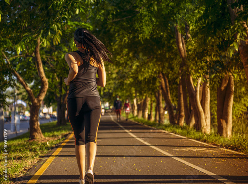 Woman jogging in the park. Healthy lifestyle and sports concepts.