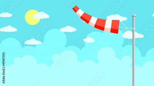 A red aerodrome windsock sways in the wind close-up against a blue sky with clouds and the sun.  Abstract looping animation with a flat pattern of transport. Looped plot.