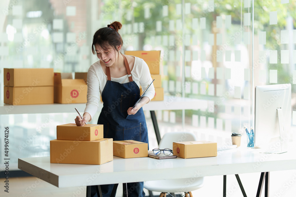 Asian small business owner working at home office. Business retail market and online sell marketing delivery, SME e-commerce concept. Asian small business owner working at home office. Business retail market and online sell marketing delivery, SME e-commerce concept.