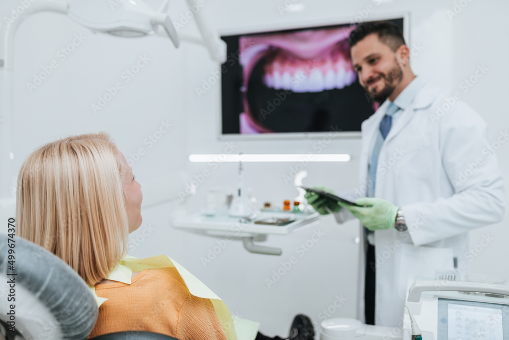Beautiful young blond woman having dental treatment at dentist's office. Beautiful young blond woman having dental treatment at dentist's office.