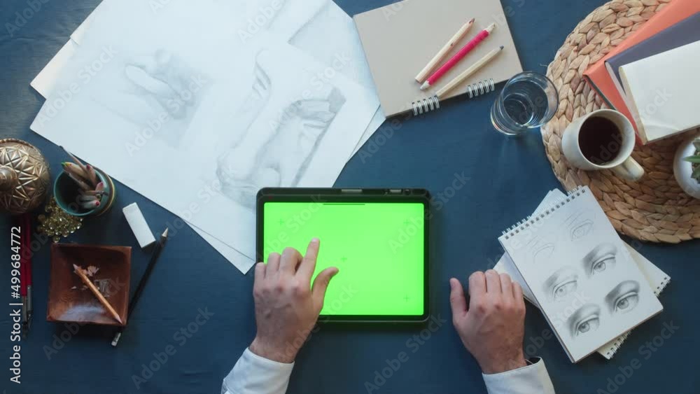 Business people using gadget with chroma green screen top view. Creative workers discussing tasks. Project planning, group brainstorming. Team leaders working in modern office together.