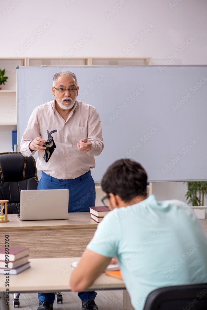 Fototapeta premium Old male teacher and young male student in remuneration concept