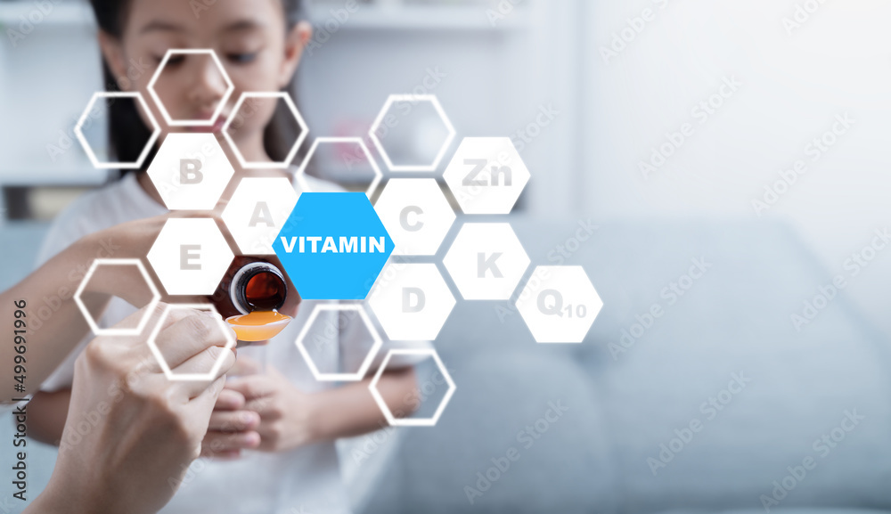 Mother is giving medicine to her sick daughter.Supplements and vitamins for children. Mother is giving medicine to her sick daughter.Supplements and vitamins for children.