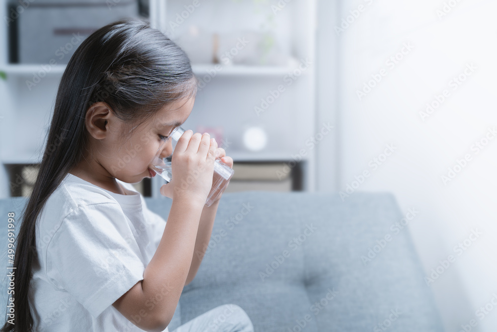 A girl is drinking water for health. A girl is drinking water for health.