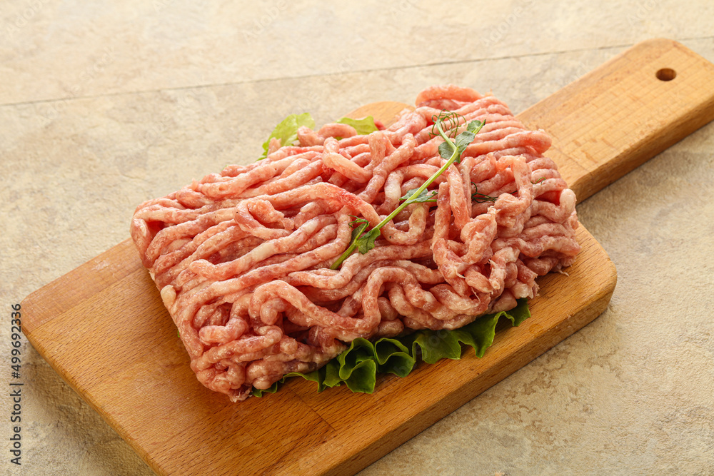 Raw minced pork meat over board Raw minced pork meat over board