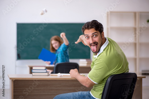 Two students having fun in the classroom