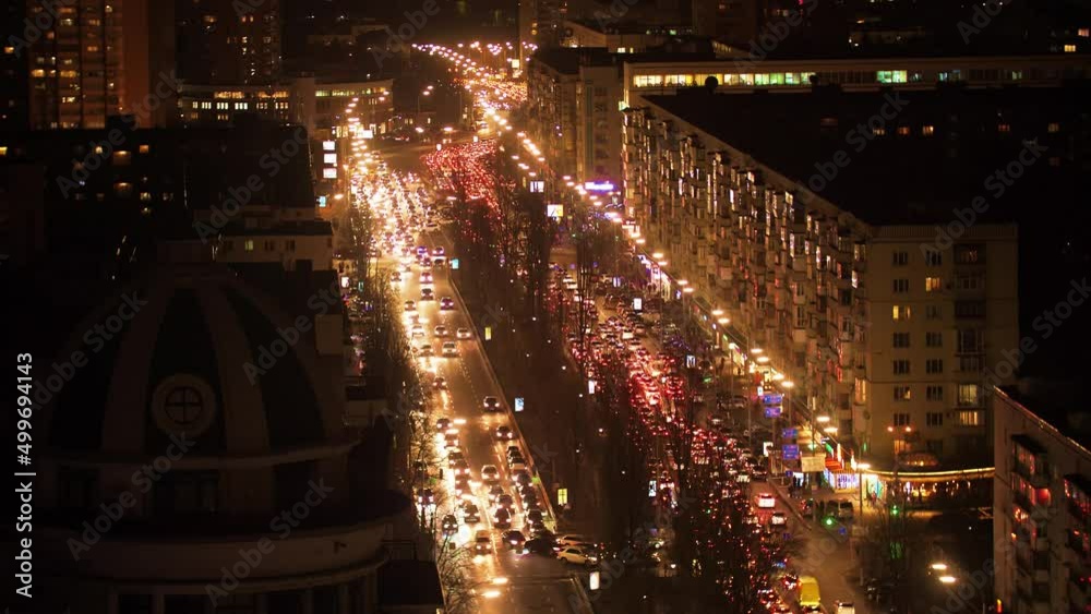 Night traffic, cars on the street road in a busy city, urban view. Kyiv, Ukraine Night traffic, cars on the street road in a busy city, urban view. Kyiv, Ukraine