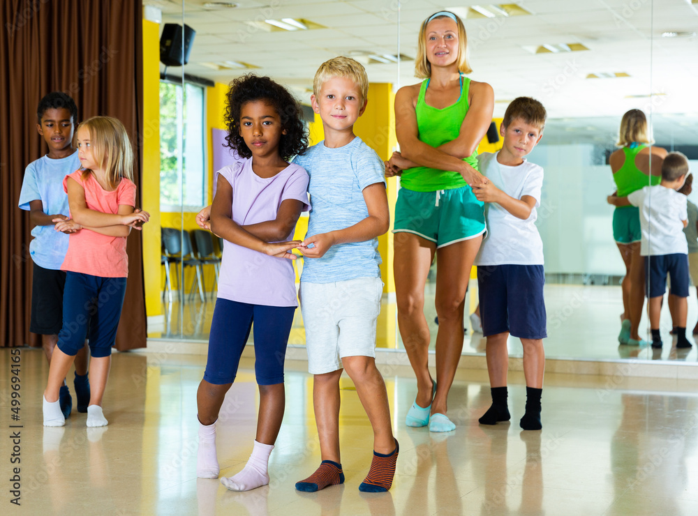 Little boys and girls dancing pair dance in the ballet studio. High quality photo