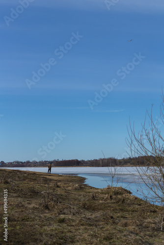 beautiful place  unknown man looking at nothing in a lake