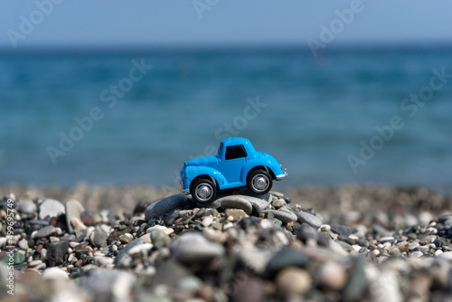 A car standing on the stones on the beach