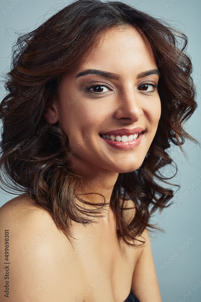 Obraz premium Be as beautiful as you. Studio portrait of a beautiful young woman with flawless skin against a grey background.