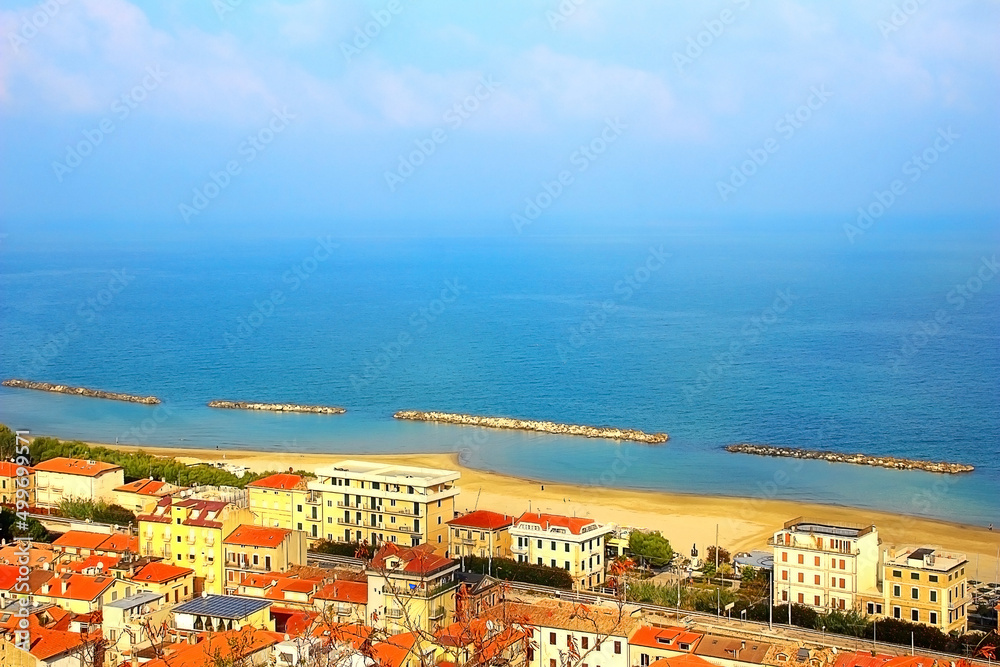 View from Cupra Alta (Marano) at some modern Italian houses of Cupra Marittima situated on a coast of the Adriatic sea in a sunny autumn day