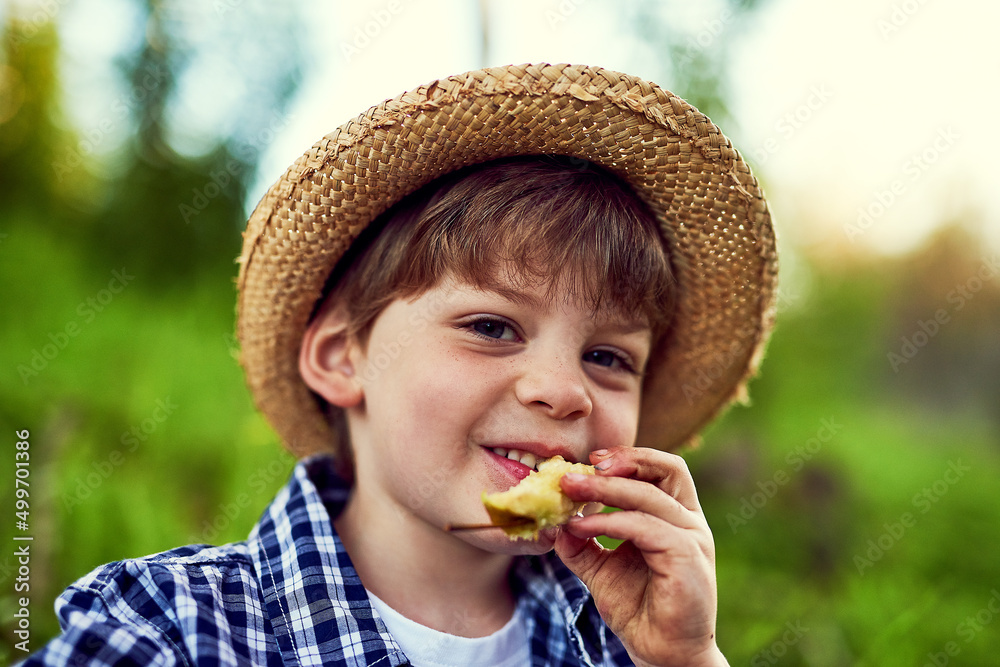 Just stopping for a snack while on my outdoor exploration. Portrait of a little boy enjoying some time outdoors. Just stopping for a snack while on my outdoor exploration. Portrait of a little boy enjoying some time outdoors.