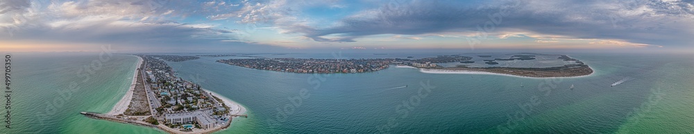 Drone panorama over Pass-a-Grille beach on Treasure Island and Pine Key area in St. Petersburg in Florida during sunset