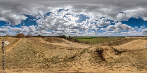 Fototapeta Naklejka Na Ścianę i Meble -  360 hdri panorama view on sand hill with sun with clouds in blue sky in full seamless equirectangular spherical projection, ready for VR AR virtual reality content
