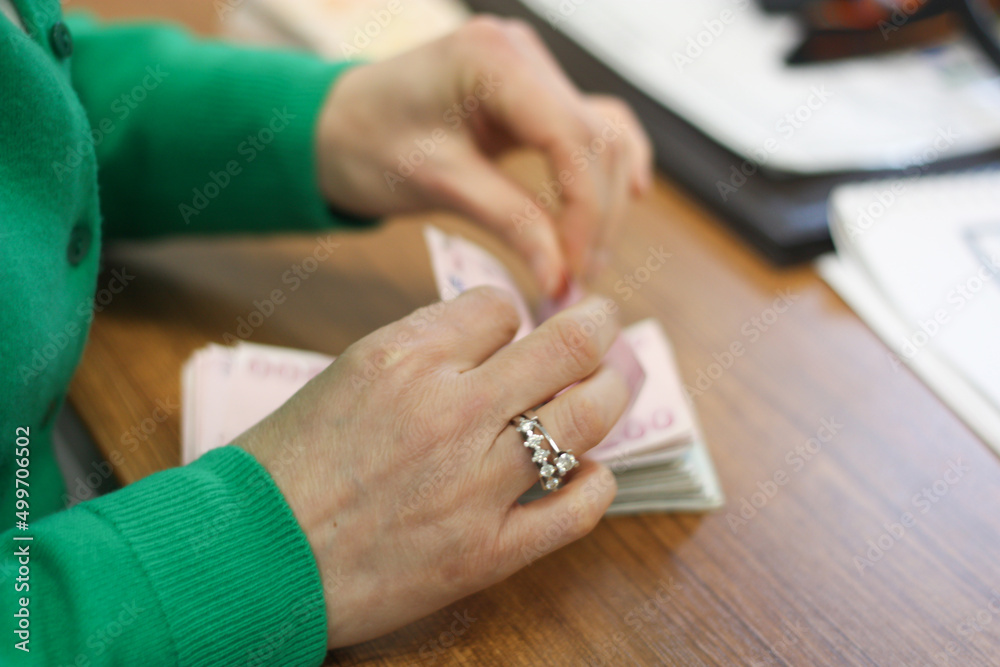 Hands counting us dollar bills. Toned picture Hands counting us dollar bills. Toned picture